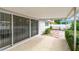 Covered patio, sliding glass doors, and access to backyard at 2124 16Th Sw Ave, Largo, FL 33770