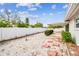 Backyard with covered patio, a fence, and stepping stones at 2124 16Th Sw Ave, Largo, FL 33770
