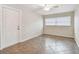 Bedroom with tile floors, ceiling fan and double door at 2124 16Th Sw Ave, Largo, FL 33770