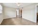 Bright bedroom with tile flooring, ceiling fan, and ample closet space at 2124 16Th Sw Ave, Largo, FL 33770