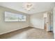 Spacious bedroom featuring tile floors and a ceiling fan at 2124 16Th Sw Ave, Largo, FL 33770