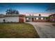 Updated mid-century home with brick accents and a spacious yard at 2124 16Th Sw Ave, Largo, FL 33770