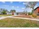 Ranch-style home showcasing a well-maintained lawn and driveway at 2124 16Th Sw Ave, Largo, FL 33770