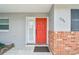 Inviting red front door entry to a newly remodeled home at 2124 16Th Sw Ave, Largo, FL 33770