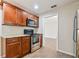 Kitchen boasts granite countertops and wood cabinets at 2124 16Th Sw Ave, Largo, FL 33770