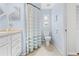 Simple bathroom with a toilet, shower, and light blue walls at 2249 Grandfather Mtn, Spring Hill, FL 34606