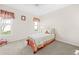 Bright bedroom with a twin bed and ample natural light at 2249 Grandfather Mtn, Spring Hill, FL 34606