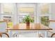 Bright breakfast nook with wooden table and window views at 2249 Grandfather Mtn, Spring Hill, FL 34606