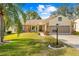 Brick ranch home with a two-car garage and landscaped lawn at 2249 Grandfather Mtn, Spring Hill, FL 34606