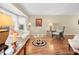 Living area with hardwood floors, comfy seating, and bay window at 2249 Grandfather Mtn, Spring Hill, FL 34606