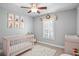 Charming Bedroom with a crib, changing table, and plenty of storage at 2314 S Clewis Ct # 201, Tampa, FL 33629