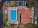 Aerial view of a community pool with a hot tub and tropical landscaping at 2353 Hanover Dr, Dunedin, FL 34698
