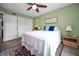 Bright bedroom features a comfortable bed and ample closet space, providing a serene and functional living area at 2353 Hanover Dr, Dunedin, FL 34698