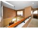 Second-story foyer with wallpaper and a view of the living space below at 2353 Hanover Dr, Dunedin, FL 34698