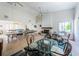Spacious game room with a fireplace, pool table, tables, and chairs at 2353 Hanover Dr, Dunedin, FL 34698