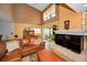 Bright living room with a fireplace, sofa, display case, and a screened-in porch at 2353 Hanover Dr, Dunedin, FL 34698