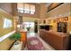 Bright living room features a cozy fireplace, hard wood floors, and comfortable seating at 2353 Hanover Dr, Dunedin, FL 34698