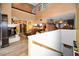 Bright open-concept living space with a fireplace and hardwood floors at 2353 Hanover Dr, Dunedin, FL 34698