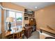 Bright office space with a vintage desk, chair, and large window offering an exterior view at 2353 Hanover Dr, Dunedin, FL 34698