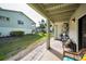 Spacious covered patio with serene backyard views, ideal for outdoor relaxation at 2353 Hanover Dr, Dunedin, FL 34698
