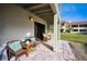 Relaxing covered patio with wicker furniture, perfect for enjoying the outdoor ambiance at 2353 Hanover Dr, Dunedin, FL 34698