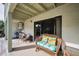 Charming covered patio with comfortable seating, offering a serene outdoor space at 2353 Hanover Dr, Dunedin, FL 34698