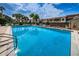 Large community pool for swimming and relaxation on a bright day at 2353 Hanover Dr, Dunedin, FL 34698