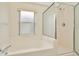 Bathroom with shower/tub combo and updated vanity at 2908 Billingham Dr, Land O Lakes, FL 34639