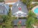 Aerial view showing a house, carport, and pool at 291 Winchester Way, Palm Harbor, FL 34684