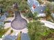 Aerial view showing home's location in a community with a cul-de-sac and pool at 291 Winchester Way, Palm Harbor, FL 34684