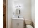 Clean bathroom with a white vanity, marble countertop, and shower at 291 Winchester Way, Palm Harbor, FL 34684