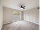 Large bedroom with window, closet and carpet at 291 Winchester Way, Palm Harbor, FL 34684