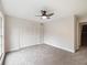 Bright bedroom with ceiling fan and closet at 291 Winchester Way, Palm Harbor, FL 34684