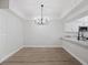 Dining area with modern chandelier at 291 Winchester Way, Palm Harbor, FL 34684