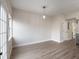 Bright dining room with hardwood floors and a view to the kitchen at 291 Winchester Way, Palm Harbor, FL 34684