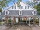 Two-story house with a carport and brick facade at 291 Winchester Way, Palm Harbor, FL 34684