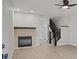Living room with fireplace and stairs at 291 Winchester Way, Palm Harbor, FL 34684