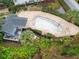 Community pool with surrounding patio and landscaping at 291 Winchester Way, Palm Harbor, FL 34684