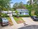 Community pool house and parking area with nearby pool at 291 Winchester Way, Palm Harbor, FL 34684