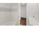 Clean bathroom with white vanity, updated shower, and tile at 2912 N 16Th St # 1/2, Tampa, FL 33605