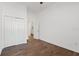 Simple bedroom with wood-look tile flooring and double door closet at 2912 N 16Th St # 1/2, Tampa, FL 33605