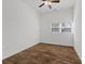 Simple bedroom with wood-look tile flooring and ceiling fan at 2912 N 16Th St # 1/2, Tampa, FL 33605