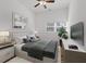 Main bedroom with wood flooring, ceiling fan and large window at 2912 N 16Th St # 1/2, Tampa, FL 33605