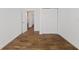 Simple bedroom with wood-look tile flooring and double door closet at 2912 N 16Th St # 1/2, Tampa, FL 33605
