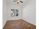 Spacious bedroom with wood-look tile flooring and ceiling fan at 2912 N 16Th St # 1/2, Tampa, FL 33605
