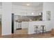 Modern kitchen with stainless steel appliances and a breakfast bar at 2912 N 16Th St # 1/2, Tampa, FL 33605
