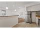 Updated kitchen with stainless steel refrigerator and granite countertops at 2912 N 16Th St # 1/2, Tampa, FL 33605