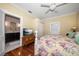 Bedroom with floral bedding and en-suite bathroom access at 308 Druid W Rd, Clearwater, FL 33756