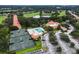 Community aerial view showcasing tennis courts, pool, and clubhouse at 34303 Sahalee Loop, Dade City, FL 33525