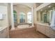 Spa-like bathroom featuring a soaking tub and double vanity at 34303 Sahalee Loop, Dade City, FL 33525